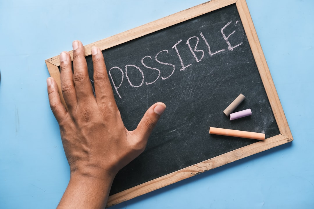 Photo by Towfiqu barbhuiya a chalkboard with the word possible written on it
