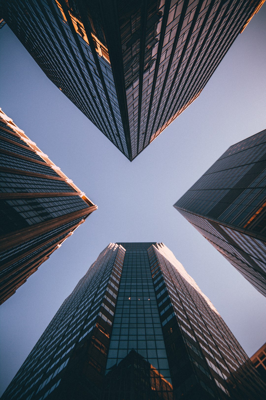 Photo by Kevin Matos low-angle photography of four high-rise buildings